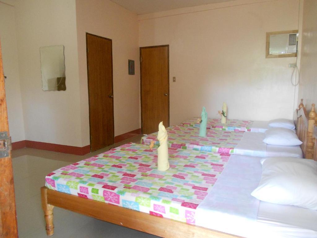 Tia Mers Guest House Puerto Princesa Номер фото